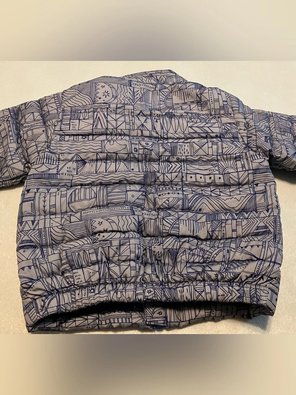 Patagonia Toddler Quilted Puffer Jacket in Light Gray with Blue Trim